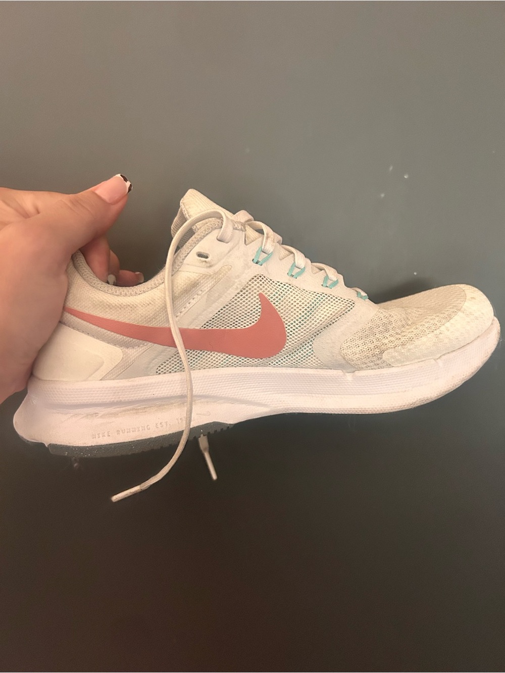 Nike Women's White Sneakers with Coral Swoosh and Teal Accents